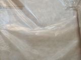 a large box that is wrapped in plastic on the floor