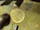 a close up of a clock with a key on it