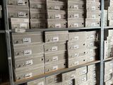boxes are stacked on a shelf in a warehouse with boxes on it