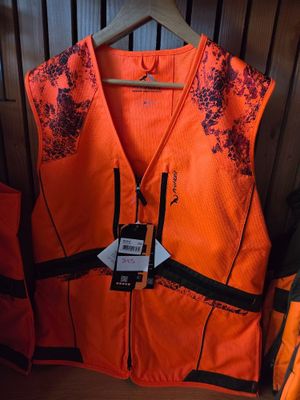 an orange vest with a black and white design on it