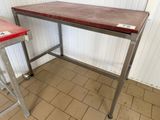 a table that has a red top on it