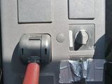 an image of a close up of a machine with a red handle