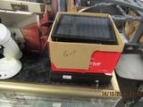 a solar panel sitting on top of a box on a table