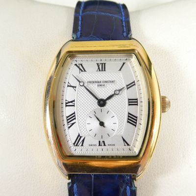 an image of a close up of a wrist watch with roman numerals