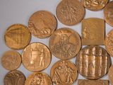 a lot of gold coins that are on a table