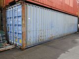 a blue container sitting in front of a red container