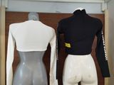two mannequins that are sitting in a room