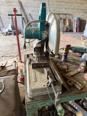 a man that is working on a machine in a garage