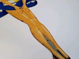a figurine of a woman sitting on a surfboard