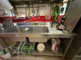 a kitchen with a sink and a dishwasher in it