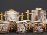 many different types of teapots and cups on the table
