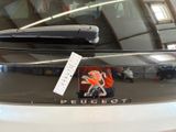 a sticker on the back of a car that says peugeot