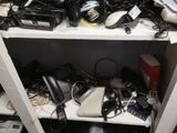 a shelf full of electronics and other electronics on it