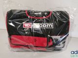 a black and red bag that is wrapped in plastic