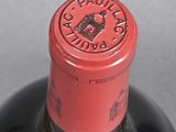 a close up of a bottle of wine on a table