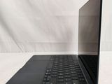 an open laptop computer sitting on top of a white table