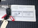 a picture of a car key and some keys on a car keychain