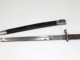 pair of old swords on a white surface with a black handle