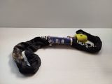 a black rope with a yellow handle on a white table