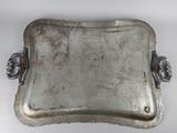 an old silver tray with handles and handles on a white surface