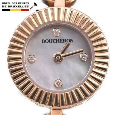 a close up of a watch with diamonds on the face