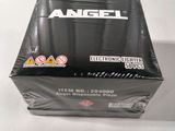 an empty box of an angel battery charger sitting on a table