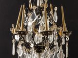 a chandelier that has a lot of crystal hanging from it