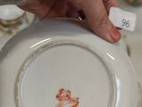 a person that is holding a plate with a picture on it