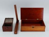 a small wooden box with a wooden handle and a wooden box with a wooden lid