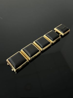 BRACELET à cinq mailles carrées Métal doré serti de bois pat…