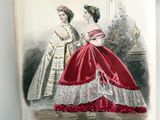 un livre sur lequel figure la photo d'une femme en robe rouge