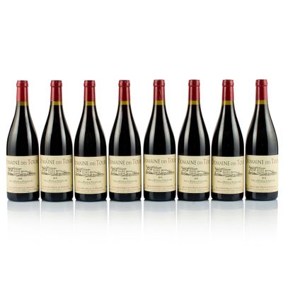 six bottles of red wine lined up in a row
