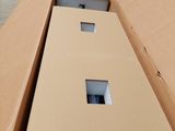 a cardboard box that has three holes in it