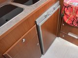 a kitchen with a sink and a dishwasher in it