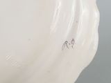 an image of a white vase sitting on top of a table