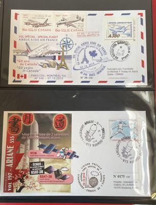 two envelopes with airmail stamps on them sitting on a table