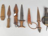 a lot of different types of knives on the table