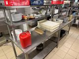 a kitchen with a lot of food on the shelves