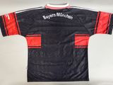 the jersey is black and red with a white stripe on it