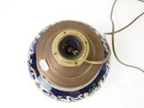 a lamp that has a blue and gold design on it