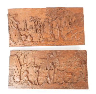 une paire de plaques en bois sculpté représentant une scène mettant en scène un fermier et sa femme