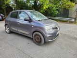 a small car that is parked on the side of the road