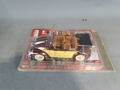 a toy car in a plastic box on a table