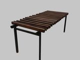 un banc en bois posé sur une surface grise
