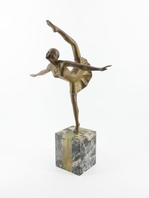 bronze statue of a woman in a dress on a marble block