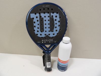 a tennis racket with a bottle of water next to it