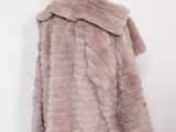 a close up of a mannequin mannequin wearing a fur coat