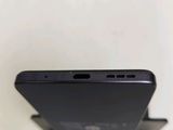 a close up of the back of a cell phone on a stand