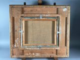 an old wooden easel with an empty canvas on it