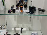 many different types of electronic devices on display in a glass case